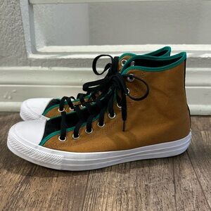 Men’s brown and green Chuck Taylor all star high tops